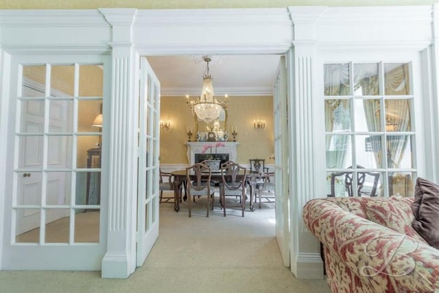 These double doors in the living room open invitingly into the dining room at the £850,000 house.