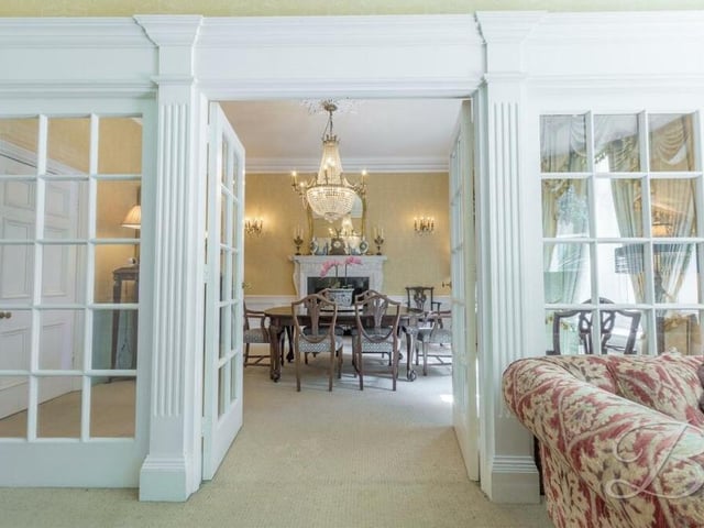 These double doors in the living room open invitingly into the dining room at the £850,000 house.