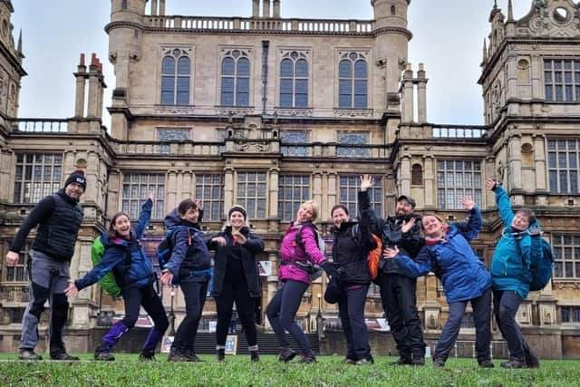 Members of Challenge Life Fitness posing for a picture outside Wollaton Hall on a practice walk.