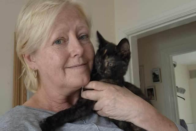 Lisa pictured with rescued cat, Robyn.