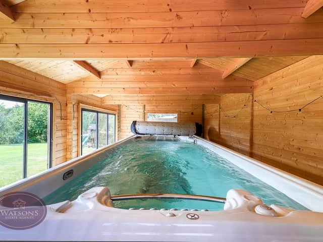 One of the large outbuildings boasts a pool.