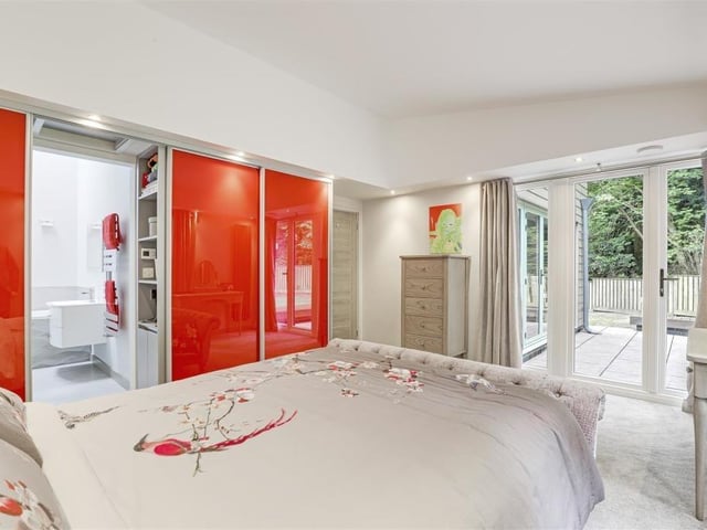 The master bedroom is an impressive sight, especially as uPVC French doors open out on to the rear patio area. It also features a carpeted floor, recessed spotlights, fitted, floor-to-ceiling wardrobes and two vertical radiators.