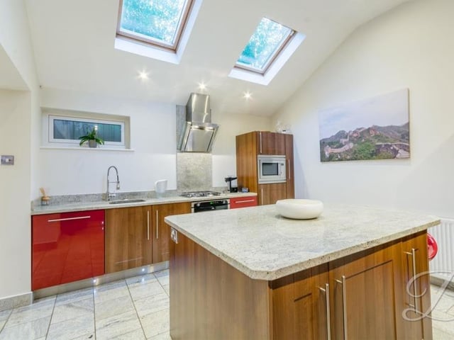 The kitchen has all you need, including an integrated oven and microwave, as well as a gas hob and extractor fan. Work surfaces incorporate a sink with chrome mixer tap above.