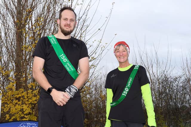 Nick Readings, left, and Sarah Cessford reached 150 parkruns at the latest Fareham event. Picture: Keith Woodland (111221-7)
