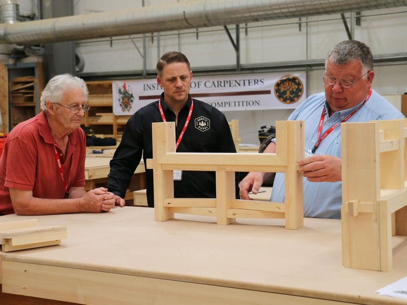 Judges inspecting the work before announcing the winners
