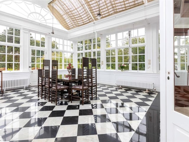 The beautiful conservatory leads out to the south lawn.