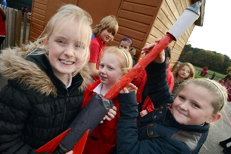 Shannon Atkinson, Maia Clark and Leah Gough with their bottle rocket named The Blaster prepare for launch at their Berry Hill Primary School.