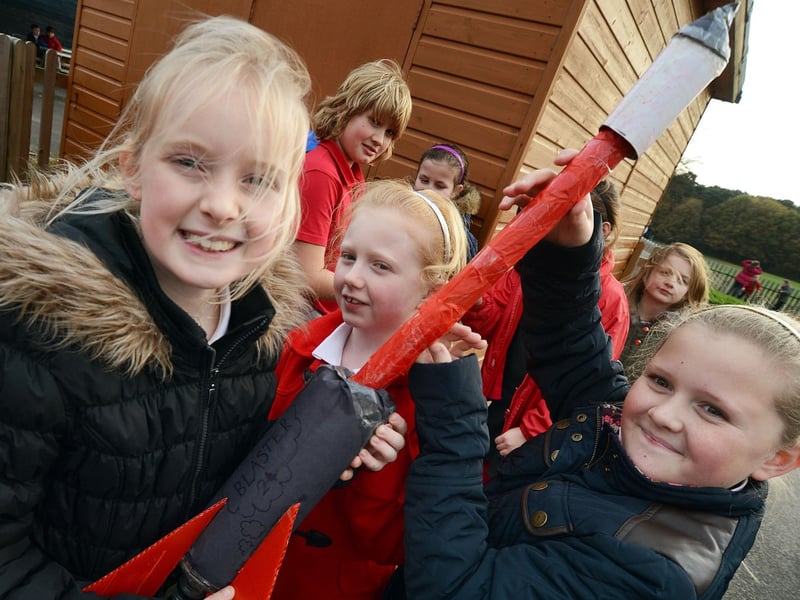 Shannon Atkinson, Maia Clark and Leah Gough with their bottle rocket named The Blaster prepare for launch at their Berry Hill Primary School.