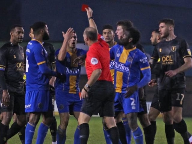 Shrewsbury's Oliver Norburn is sent off.