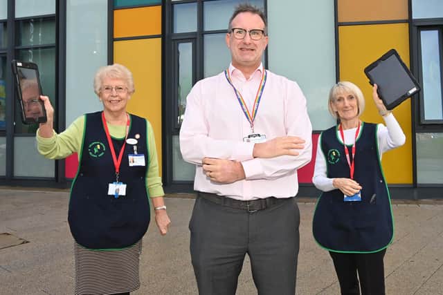 Chief nurse Phil Bolton with two volunteers at King’s Mill Hospital