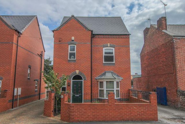 This four bedroom detached house has off road parking and three bathrooms. Marketed by Redbrik Estate Agents, 01246 920990.