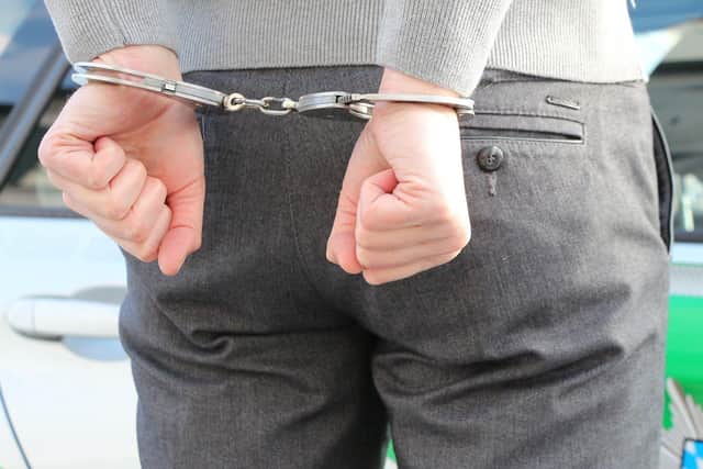 A man has been arrested and charged after spitting at police saying he had Coronavirus