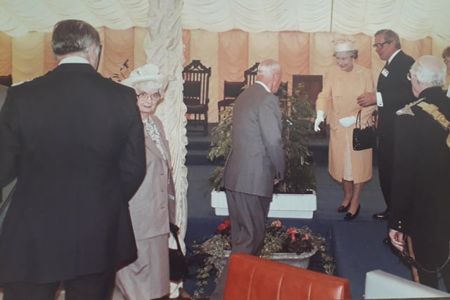 Her Majesty greets someone at Portland College in 1990.