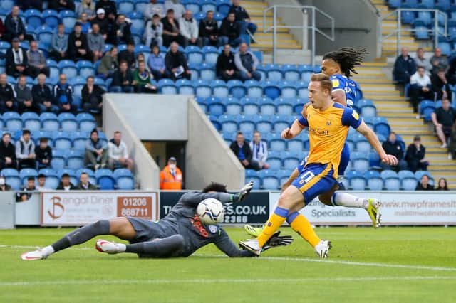 Danny Johnson's first half finish is saved by the Colchester keeper : Photo Chris Holloway.