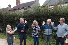 Wesley Street allotment holders celebrate victory with a tipple