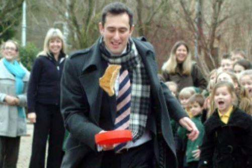 School head Domenicco Conidi showing off some multi-tasking skills during one of the races.