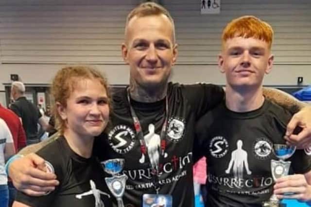 Brooke Butler and Travis Roe with coach Christian Smith.