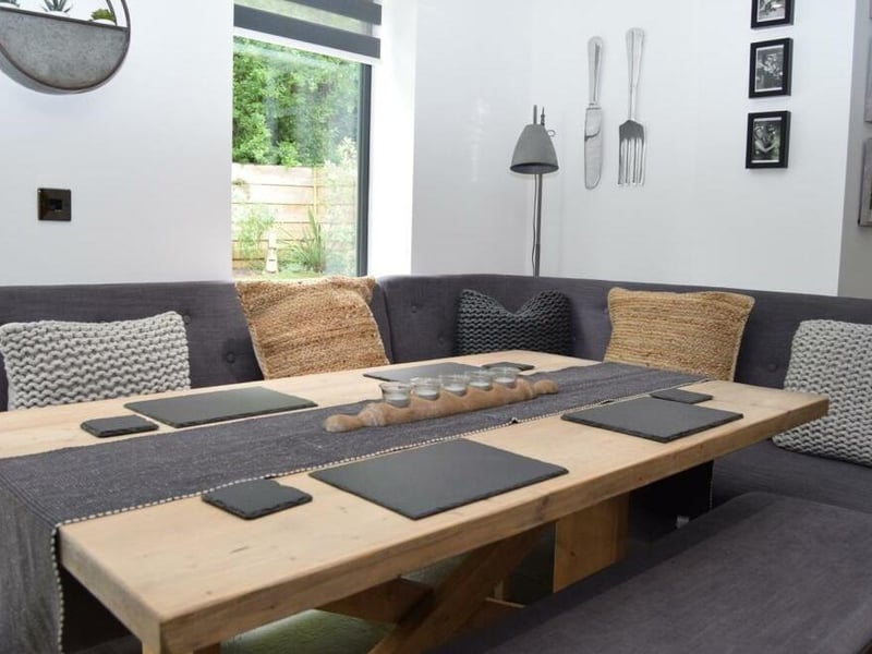 The kitchen has plenty of space for a dining table and chairs, complete with a view that overlooks the back garden..