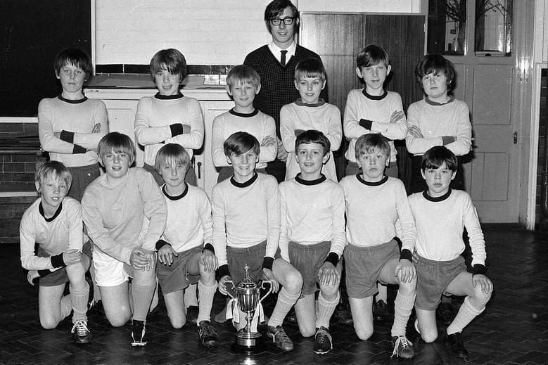 The school football team is pictured in 1971. The school closed in 2001 and became Asquith Primary School.