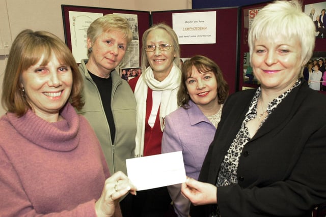 Sue Reader, Sue Hodge, Joan Kenyon and Chris Cieslik of the Life After Breast Cancer Support Group, hand over the cheque for £10,705 to Vanessa Whaley, head of the Lymphoedema service back in 2003