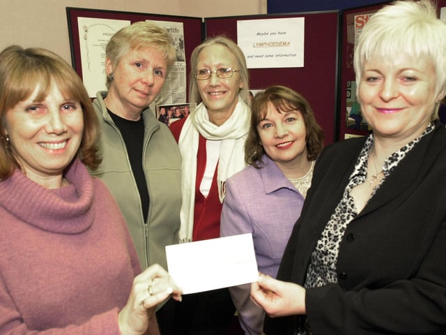 Sue Reader, Sue Hodge, Joan Kenyon and Chris Cieslik of the Life After Breast Cancer Support Group, hand over the cheque for £10,705 to Vanessa Whaley, head of the Lymphoedema service back in 2003