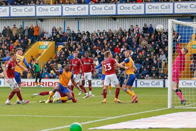 Oli Hawkins heads Mansfield Town into the lead against Northampton Town. Pic by Chris Holloway