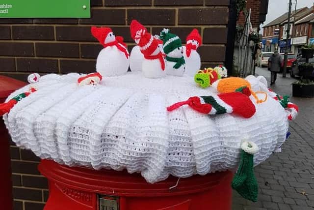 Knitted snowmen on the postbox along Nottingham Road, Eastwood.
