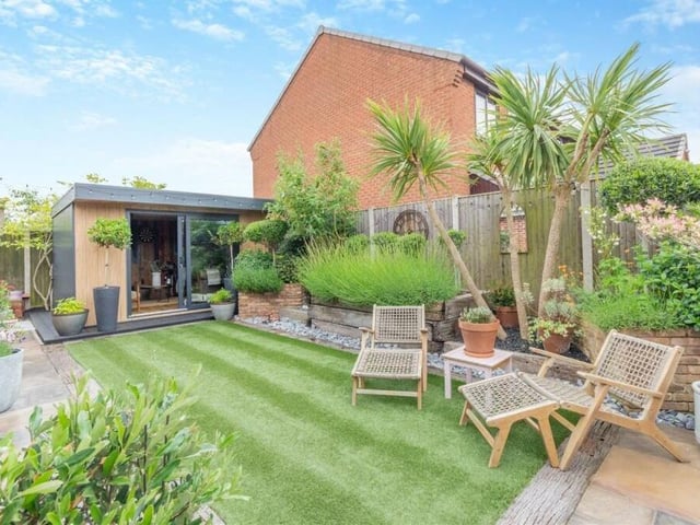 At one end of the garden is a bespoke-built garden room that is a wonderful addition to the property and can be used all year round.