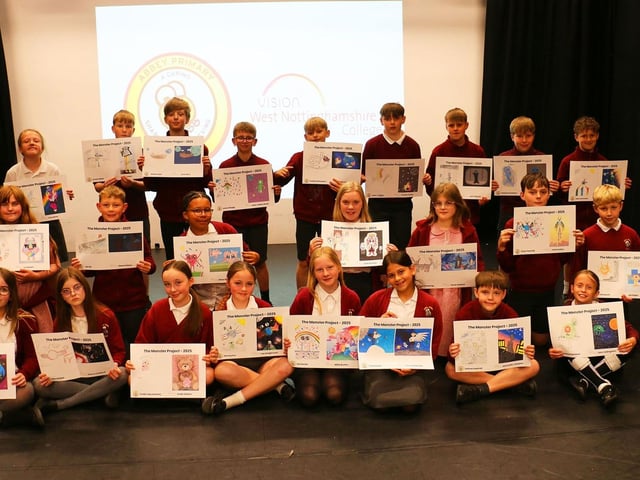 Happy pupils with their artwork in the college's Create Theatre