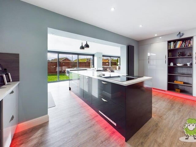 A second shot of the classy kitchen, which also features expansive windows, giving views of the back garden at the £525,000 property.