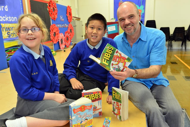 Author Steve Hartley with Ward Jackson Primary School pupils Kendra Robertson and Kevin Zhang in 2014.