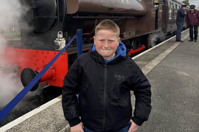 Young train lover Sky Thirkill (10) prepares for departure on this historic Peak Rail steam train.