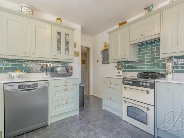 The kitchen is a haven for budding chefs, with plenty of space for preparing meals and for a host of modern appliances. There is also plumbing for a dishwasher.