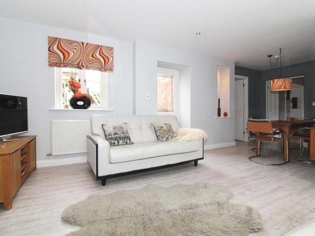 A second shot of the lounge, which is clean and bright, and opens into the dining room.