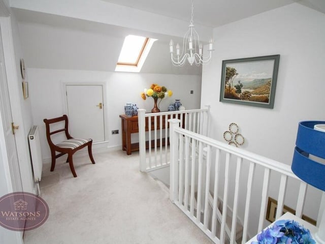The galleried landing on the first floor of the Kimberley house is a lovely spot. It features a Velux window and fitted storage cupboards.