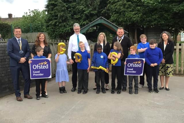 Staff and pupils at Redgate Primary Academy in Mansfield celebrating the awarding of a 'Good' rating by Ofsted inspectors.