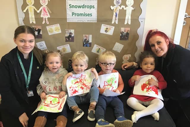 Pictured are the some of the Cherubs Wyndale Snowdrops children with (left) Charlotte Eason, a level two early years educator and (far right) Chloe Wright level three early years educator.