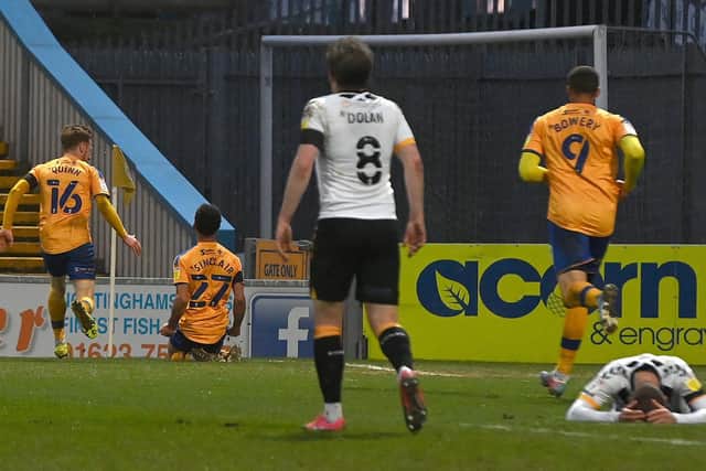 Mansfield's players celebrate Tyrese Sinclair's equaliser.