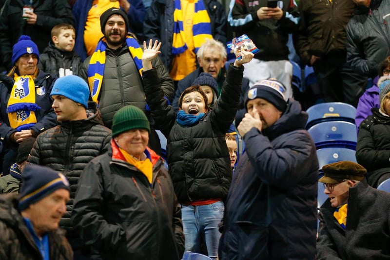 Mansfield Town's faces in the crowd against Swindon Town.