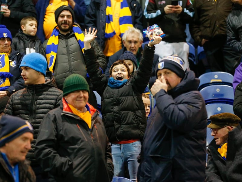 Mansfield Town's faces in the crowd against Swindon Town.