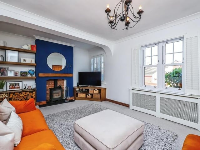 Let's start our tour of the £580,000 Bagthorpe house in the cosy living room, complete with log-burning feature fireplace.