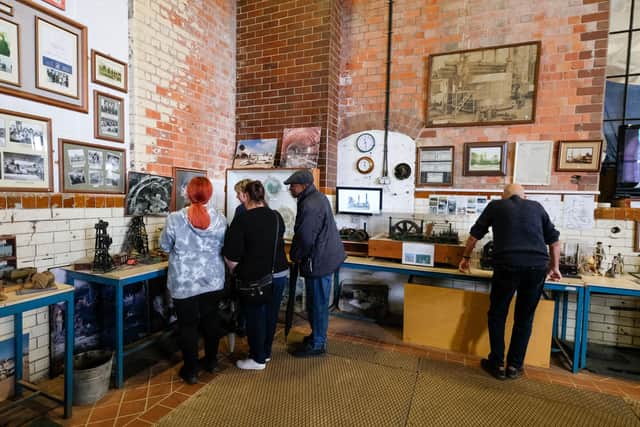 Visitors check out the many exhibits on display at Pleasley Pit Coal Mining Heritage Site. Photo by Dean Atkins.