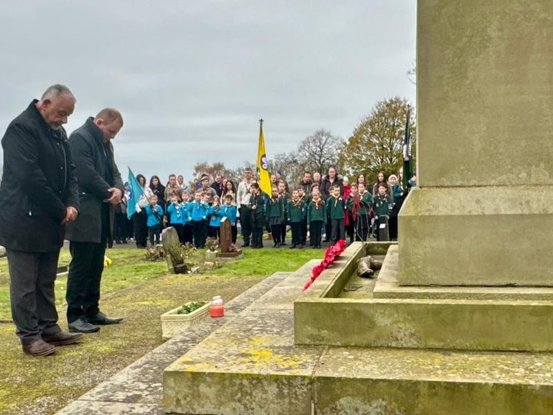 Couns Paul Grafton and Tom Hollis pay their respects at the Huthwaite war memorial