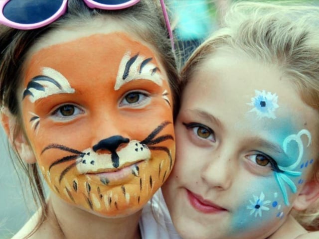 Elle-Billy Dobbin and Charlotte Oakley show of their facepaint at Mansfield's Crescent Primary School summer fair.