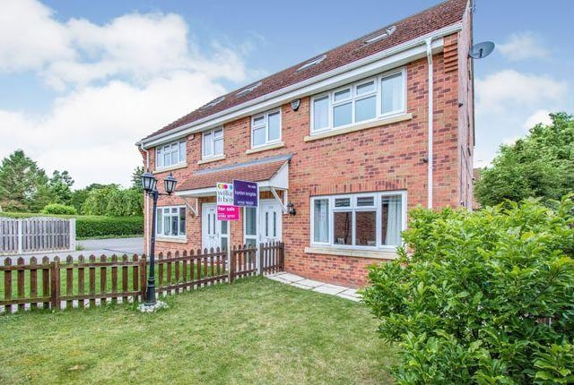 This four bedroom house has a modern conservatory.