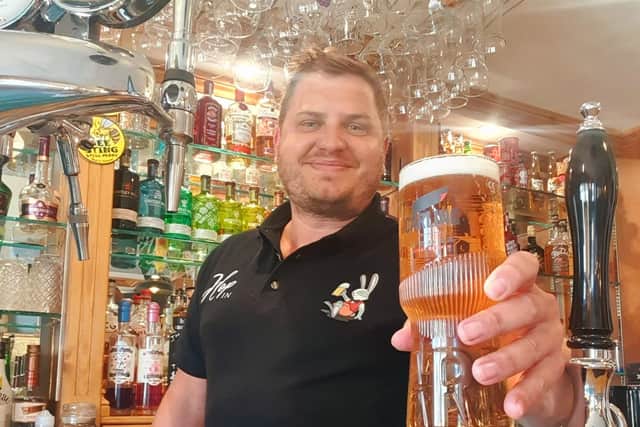 Ian pictured behind the bar at the Hop Inn, Pinxton.