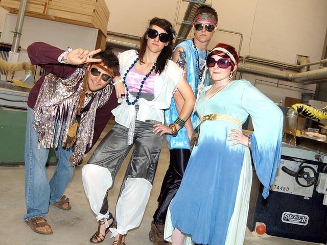 Rebecca Hollis, right, shows off her 'Flower Bombs are Harmless' collection which she put together for the West Notts College fashion show, as part of her year 2 Fashion and Textiles studies. The show was staged at the Kirkby Construction Academy and featured from left, Jacomo Nardi-Forster, Natasha Kelly and Luke Black, along with students working on the Ashfield Neet program, the Btech National Diploma clothing and textiles and Foundation and Art. Year: 2010.
