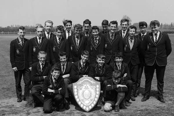 These Manor School pupils show off an impressive sports shield in 1963.