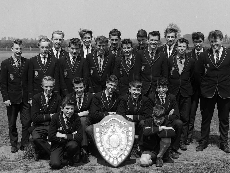 These Manor School pupils show off an impressive sports shield in 1963.