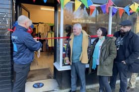 Eileen Massey at the ceremony to officially open her Veterans Unite shop on Bridge Street, Mansfield. Cutting the ribbon is Jay Rowlinson, chief executive officer of Mansfield BID who is a former Army major, watched by Cllr Sid Walker, of the district council.